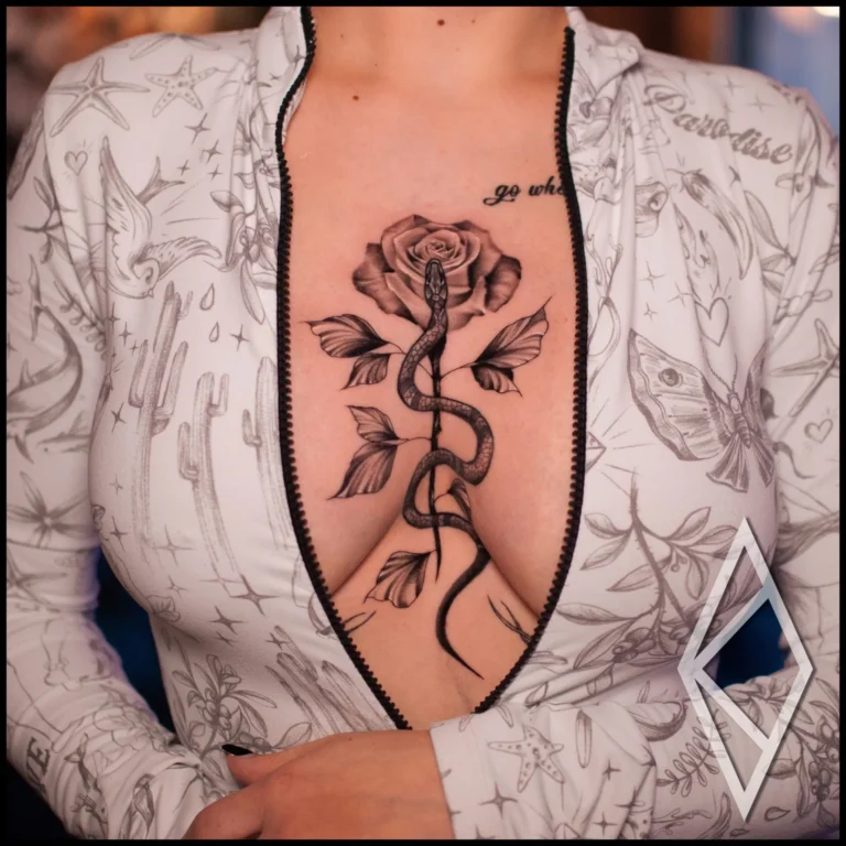 Snake and a rose on woman's chest, fineline with pepper shading