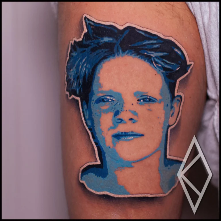 Sticker portrait tattoo in color on thigh, son portrait