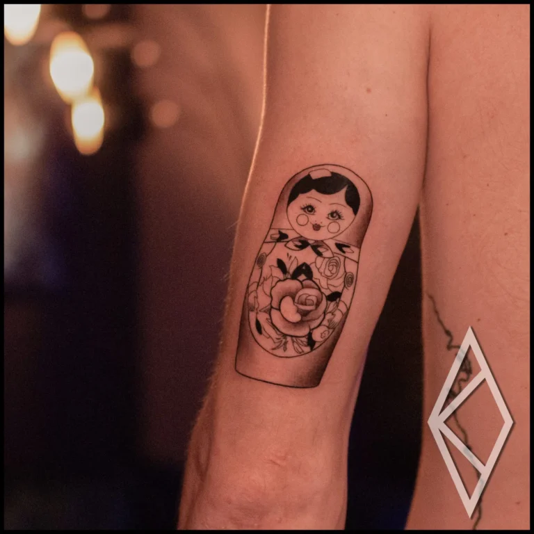 matryoshka tattoo on mans tricep